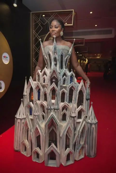 BBC/MOBOLAJI OLATUNDE  Nana Akua Addo in her outfit designed like a cathedral.