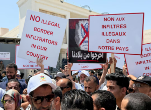 Libyans block off UN refugee office in protest against migrants